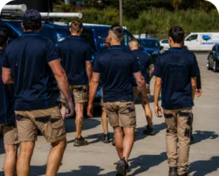 Plumbers walking to their service vans on a Bexley job